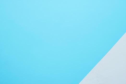 Bright blue surface with white corner creating a modern backdrop photo