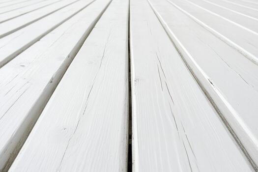 Wooden planks arranged in a diagonal pattern on a bright surface photo