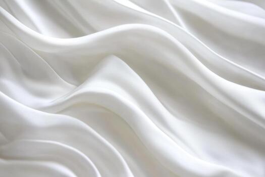 Soft white fabric draping elegantly with gentle waves and folds photo
