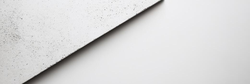 Surface with a textured gray slant against a plain white background photo