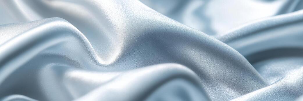 Soft blue silk fabric draped elegantly with gentle waves and folds photo