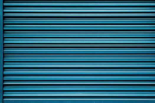 Striped metal surface with blue tones in an urban setting for background use photo