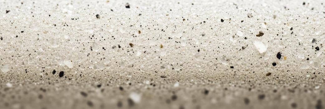 Fine texture of sand with small stones on a beach at low tide photo