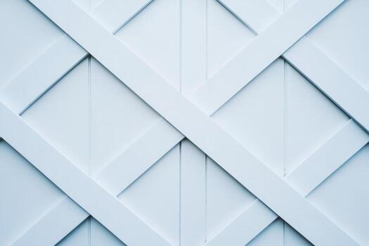 Wooden lattice design in light blue with diagonal patterns on a fence photo