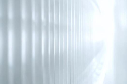 A hallway features smooth, white walls reflecting soft light photo