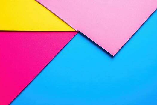 Colorful paper shapes overlapping on a bright blue background photo