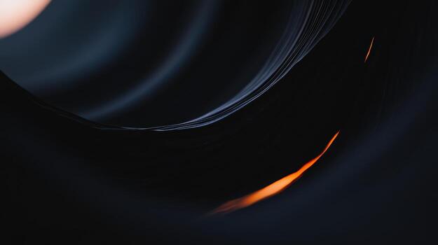 Exploring the intricate design of a black spiral with a hint of orange glow photo