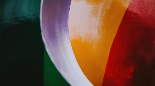 Bright colors blend in a circular pattern against a textured background photo