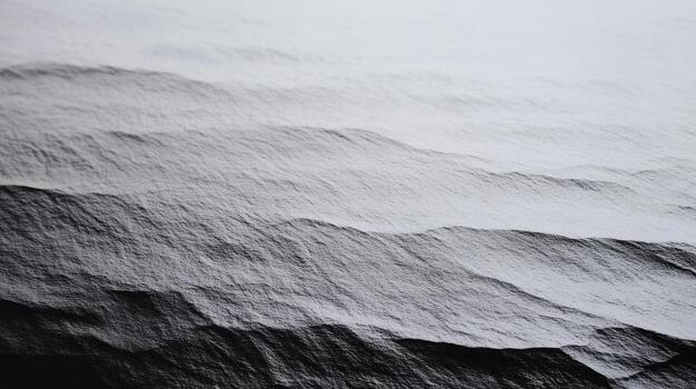 Texture of black and white waves on a smooth surface under soft light photo