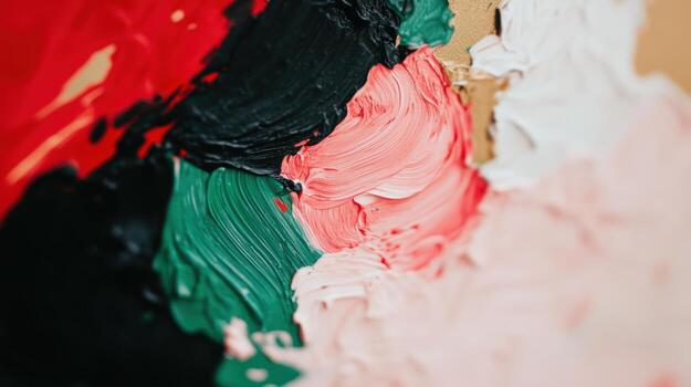 Colorful paint mixture on canvas during an art creation process photo