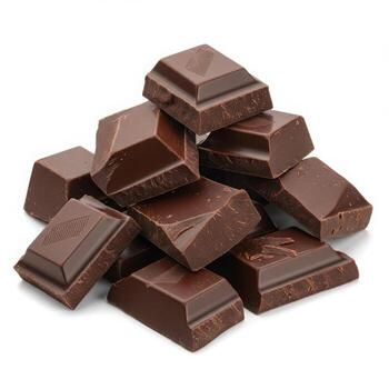 Pile of dark chocolate squares arranged randomly on a surface isolated on white background photo