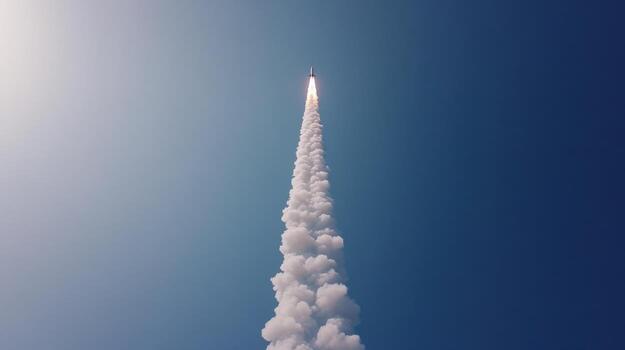 A rocket is flying through the sky with smoke coming out of it photo