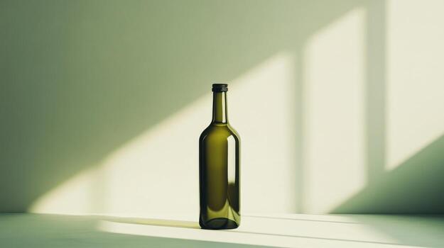 A bottle of wine sitting on a table in front of a window photo
