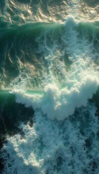 An aerial view of waves breaking on the shore photo