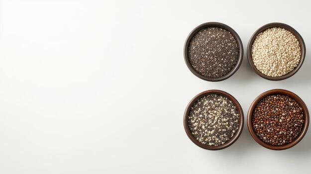 Four bowls of different types of seeds photo