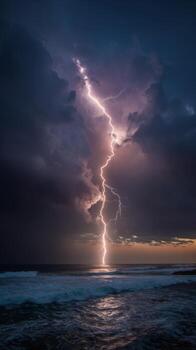 A Vertical Photo Capturing Lightning As It Strikes The Sea