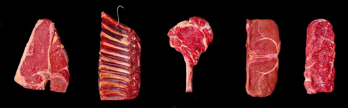 Different cuts of beef displayed on a black background for culinary presentation photo