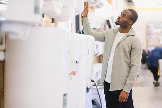 Man looking at home appliances photo