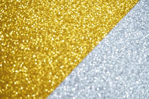 Bright gold and silver glitter texture with sparkling bokeh effect creating a festive and elegant background. photo