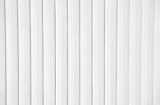 White vertical lines pattern symmetrical minimalist background with clean modern design. photo