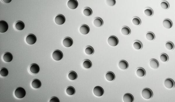 Surface With Many Circular Indentations Creating Interesting Patterns and Subtle Shadows photo