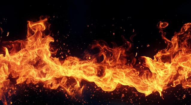 Vibrant Flames Create Mesmerizing Patterns Against a Dark Background During a Nighttime Fire Display. photo