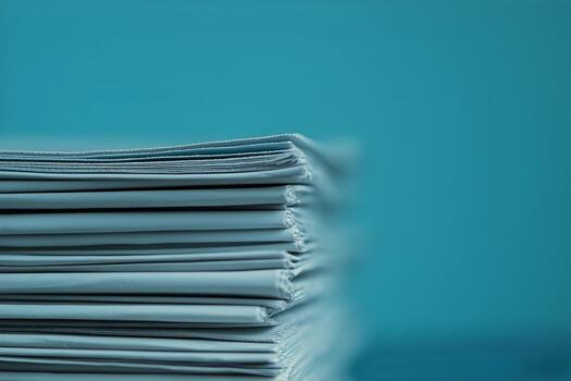 Newspapers Stacked Neatly on a Table in Cozy Indoor Setting During Morning Hours photo