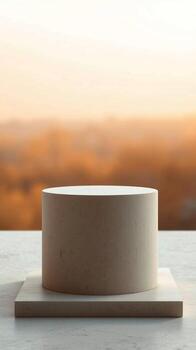 Minimalist cylindrical podium display with soft gradient background for product presentation photo