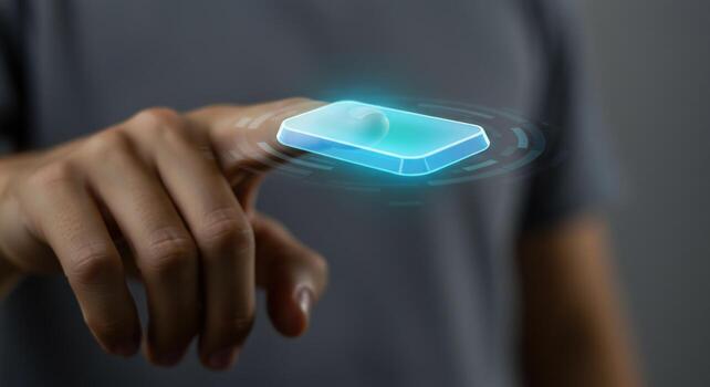 Finger touching abstract technology interface with neon glow effect photo