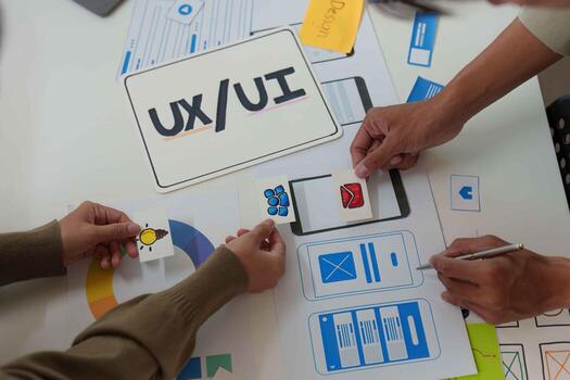 UX UI Design Workshop. Team members collaborating on user interface sketches. photo