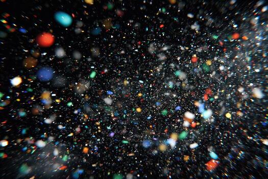 A black background with many colorful confetti falling photo