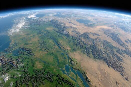 Earth's terrain, from a distant vantage point. Lush landscapes, vast deserts, and mountain ranges are visible photo
