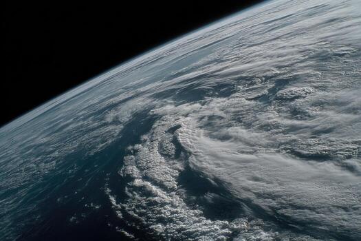 Earth from space, swirling clouds over ocean photo