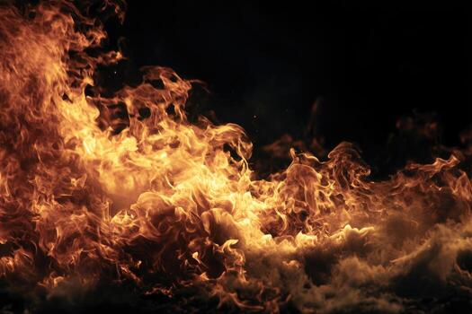 Fiery flames against a dark backdrop photo