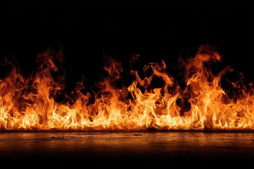 Fiery flames on a dark surface photo