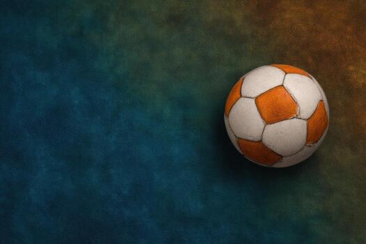 Worn soccer ball on a mottled surface photo