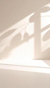 Soft shadows of leaves on a light beige wall and surface photo
