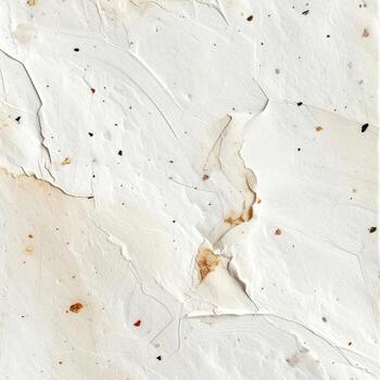 Textured, white surface with light beige and brown flecks photo