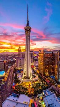 High-angle view of a tall tower at sunset over a city photo