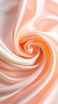 Soft peach-toned silk fabric, swirling in a flowing pattern photo