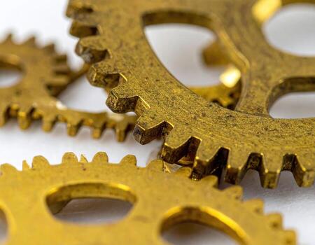 Close-up of brass gears, intricate and detailed photo