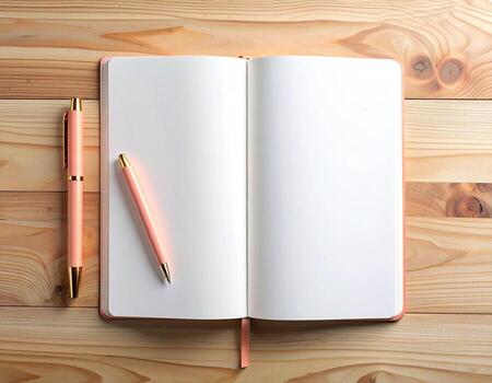 Open notebook and pen on a light wooden table. Blank pages are ready for writing. Pastel pink notebook and pen. Flat lay photo