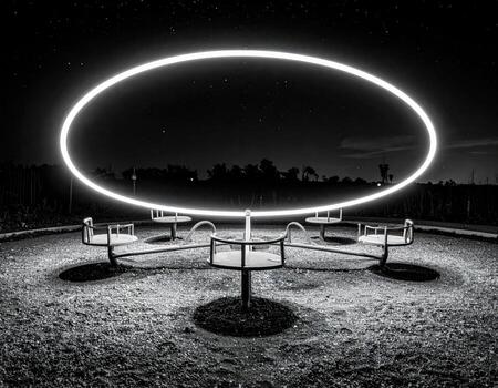 Illuminated playground ring at night photo