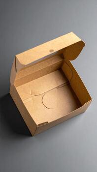 Open light brown cardboard box, rectangular shape, simple design photo