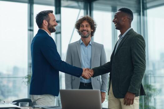 Business professionals engage in a friendly handshake while networking in a modern office during daytime photo