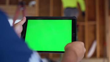 Engineer using his tablet at Home Renovation, repair or construction process. Camera move video