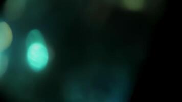 Lens flare with chaotic bokeh highlights on black background, Light leak bokeh for overlay. video