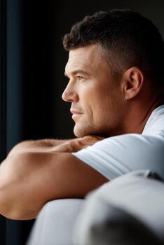 A man looking out the window photo