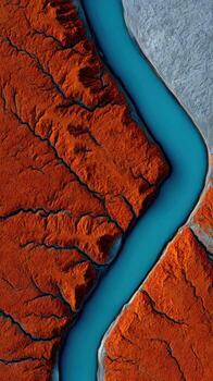 An aerial view of a river flowing through a desert photo