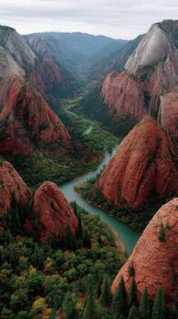A river runs through a canyon surrounded by red rocks photo